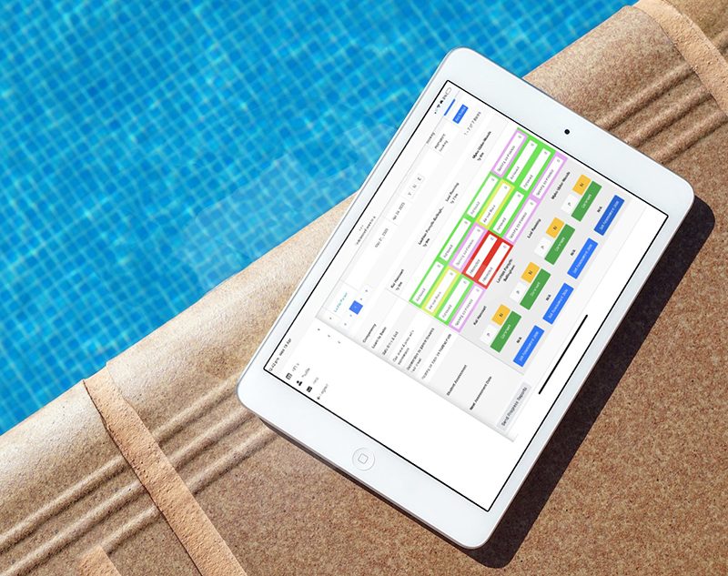 First Class software on tablet on swim school pool deck